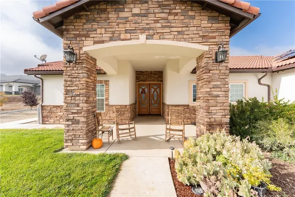 a view of front door of house with outdoor space