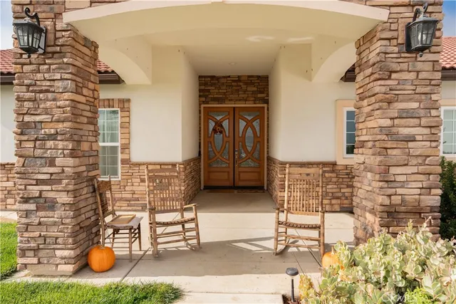 a living room with furniture a rug and a window