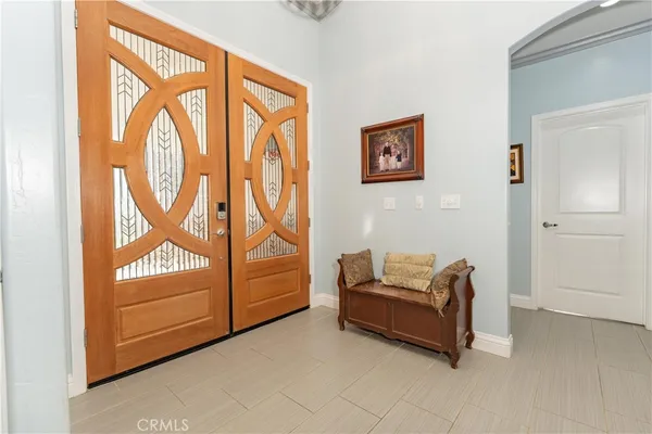 a living room with furniture ceiling fan and a rug