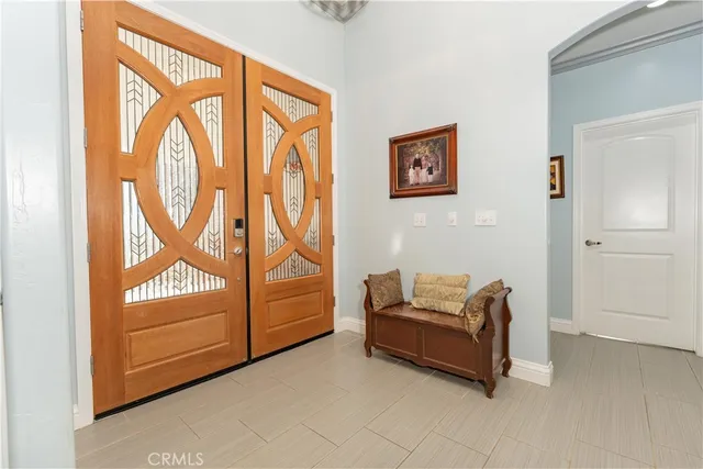 a living room with furniture ceiling fan and a rug