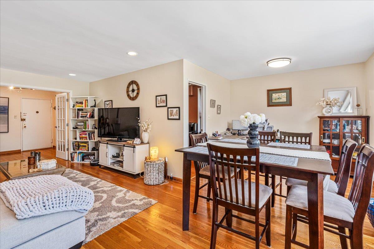 211-10 18th Avenue, Unit 2J Queens, NY 11360 - Photo 11 of 24 a living room with furniture and a flat screen tv