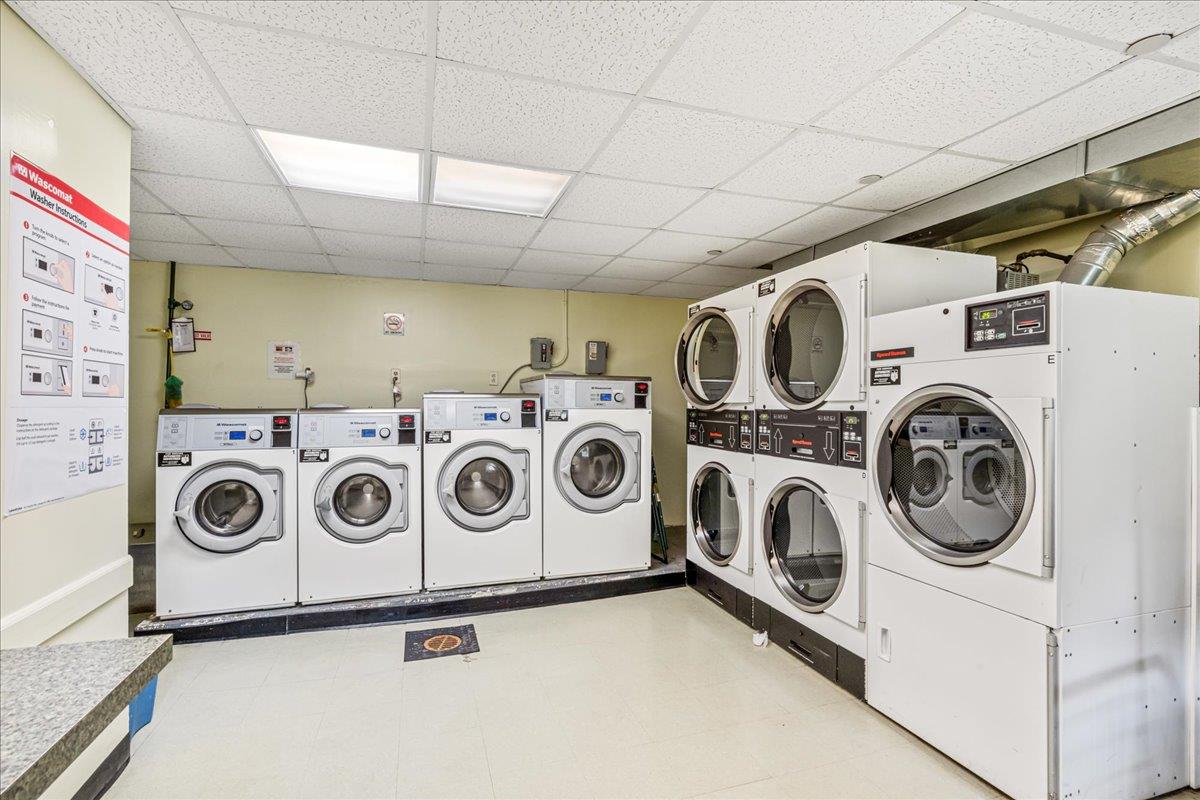 211-10 18th Avenue, Unit 2J Queens, NY 11360 - Photo 21 of 24 a utility room with dryer and washer