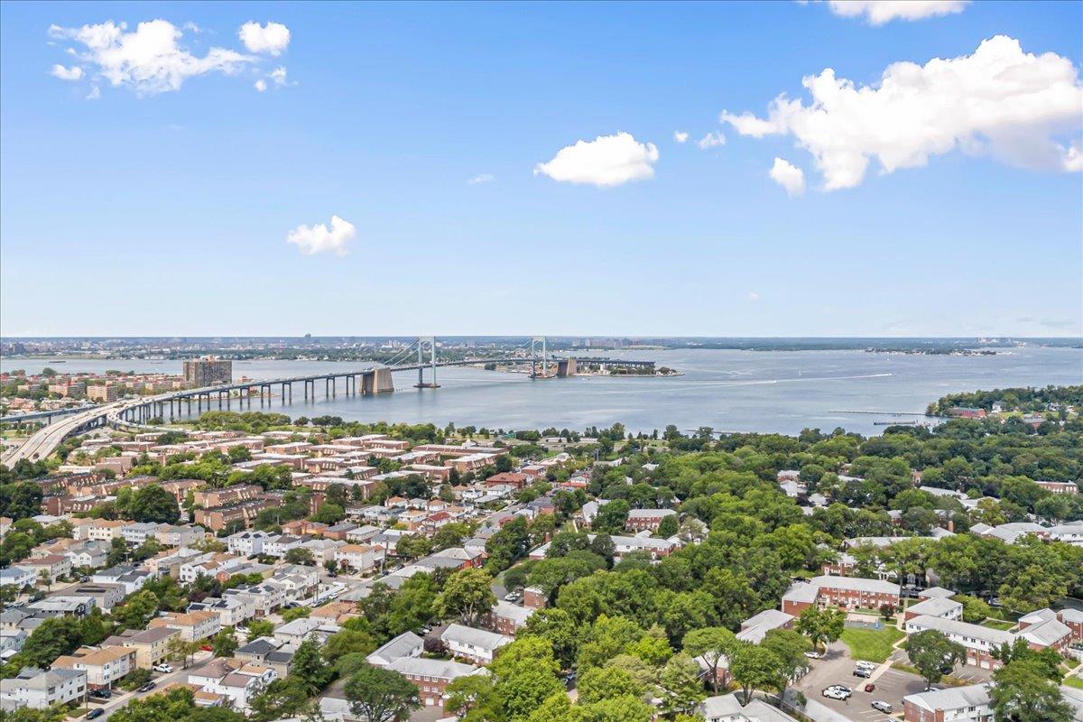 211-10 18th Avenue, Unit 2J Queens, NY 11360 - Photo 22 of 24 a view of a large body of water with lots of residential buildings