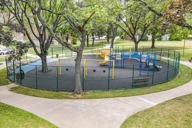 a view of a chairs and table in the backyard
