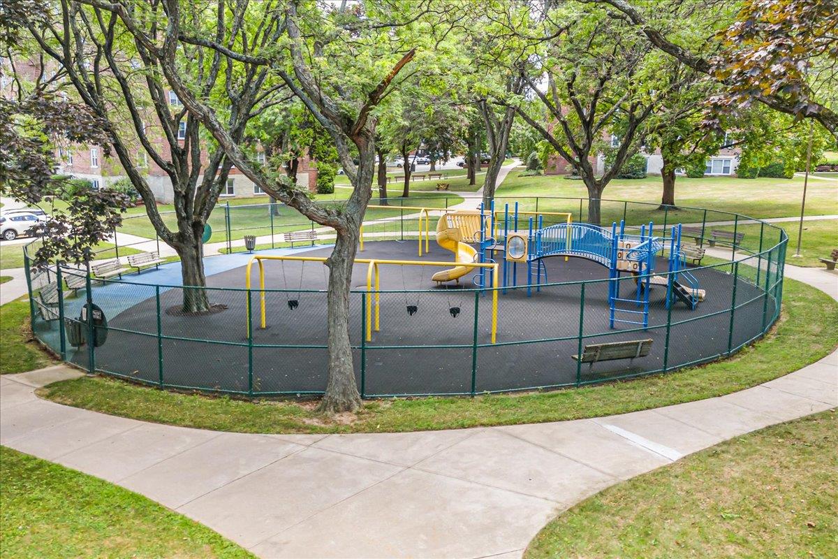 211-10 18th Avenue, Unit 2J Queens, NY 11360 - Photo 23 of 24 a view of a chairs and table in the backyard