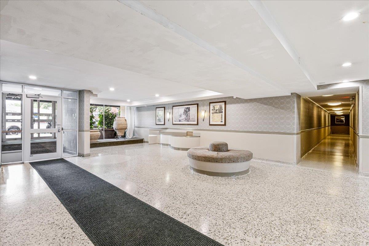 211-10 18th Avenue, Unit 2J Queens, NY 11360 - Photo 3 of 24 a living room with furniture and a wooden floor