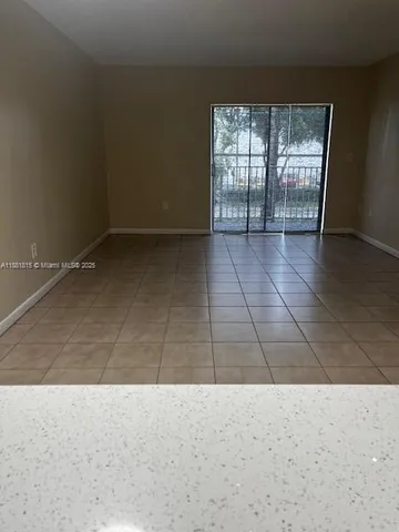 a bathroom with a shower a toilet and a sink