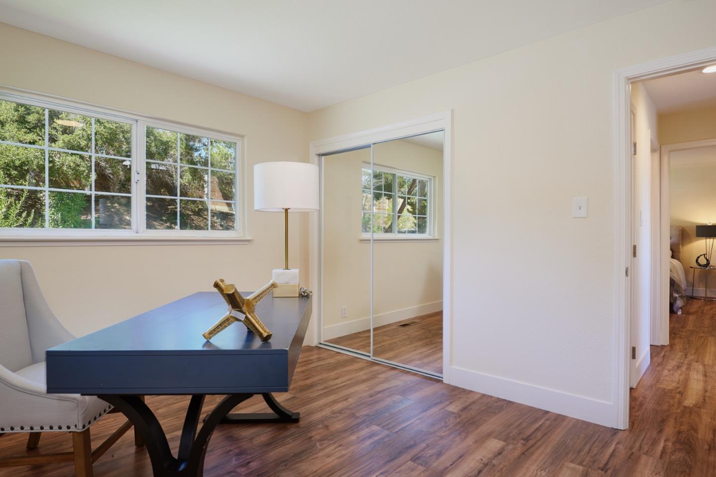1132 Lassen Drive Belmont, CA 94002 - Photo 20 of 27 a view of a workspace with furniture and a window