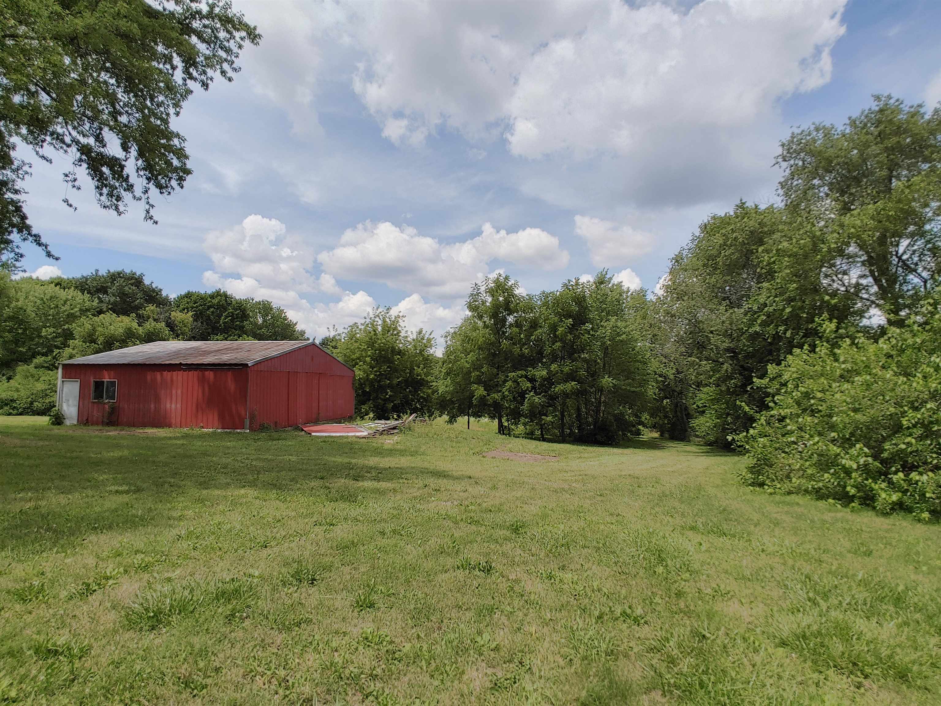 5152 Blackhawk Road Rockford, IL 61109 - Photo 11 of 31 a backyard of a house with lots of green space