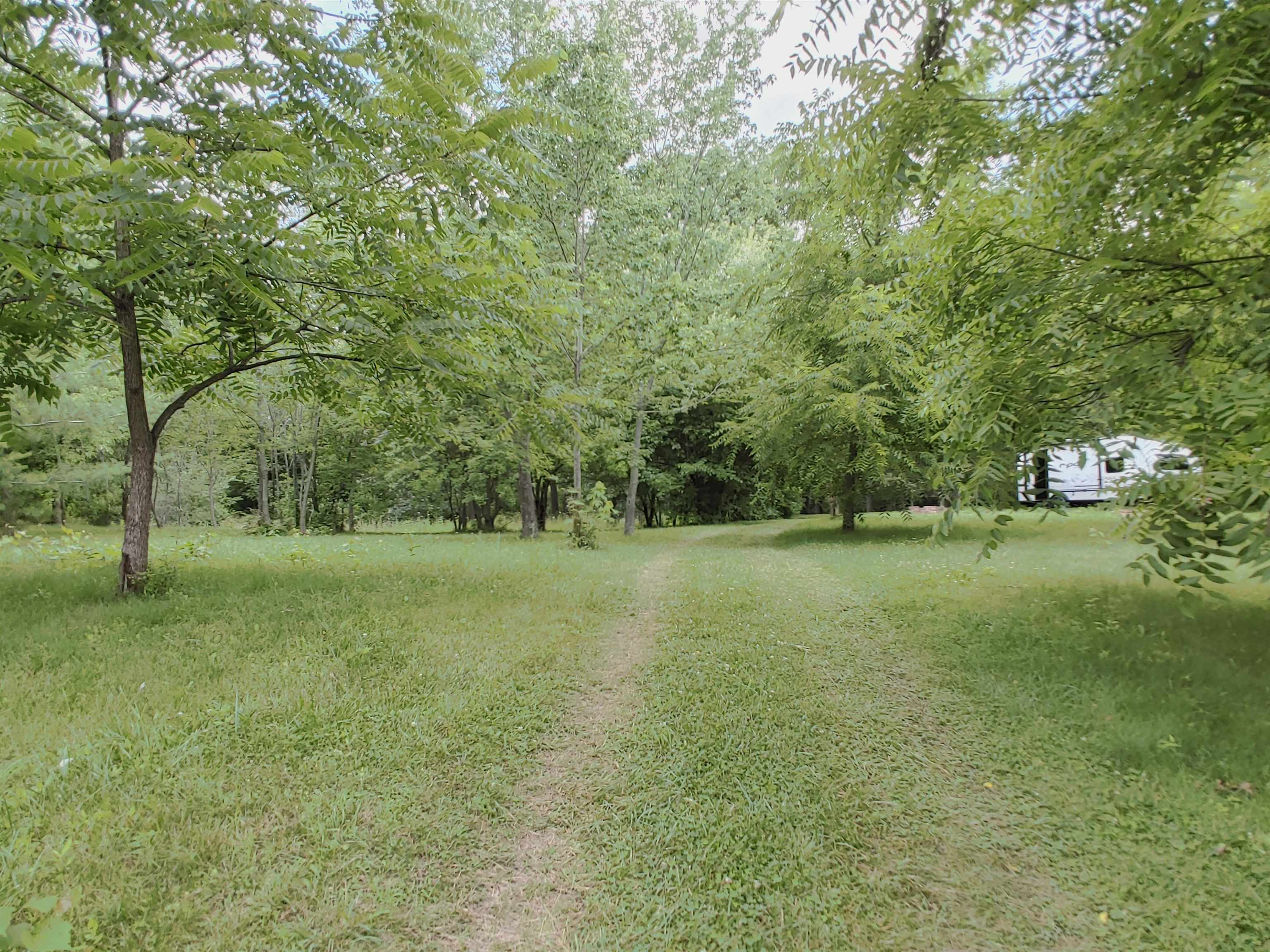 5152 Blackhawk Road Rockford, IL 61109 - Photo 16 of 31 a view of outdoor space with green field and trees