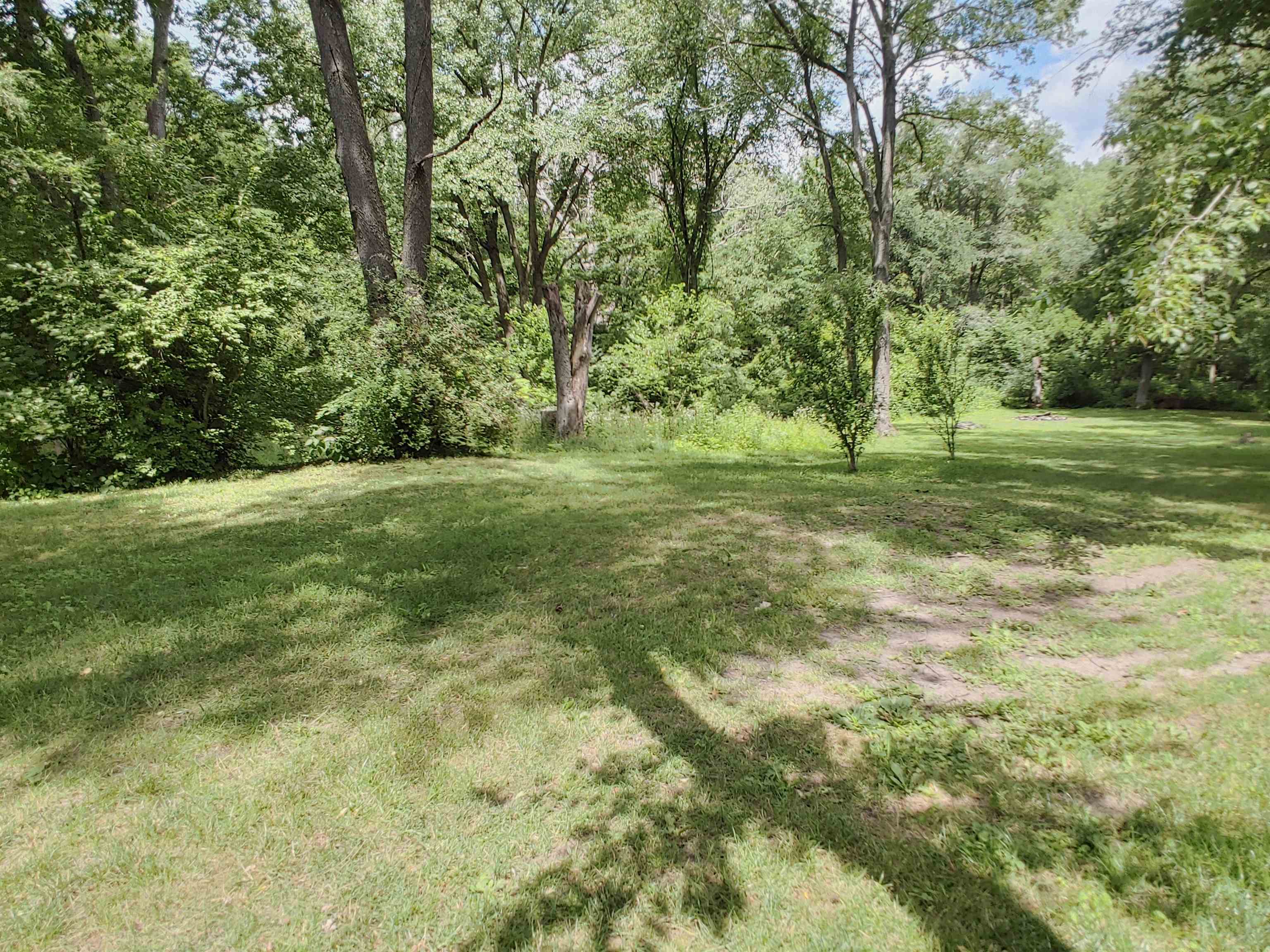 5152 Blackhawk Road Rockford, IL 61109 - Photo 17 of 31 a view of a field with trees in the background