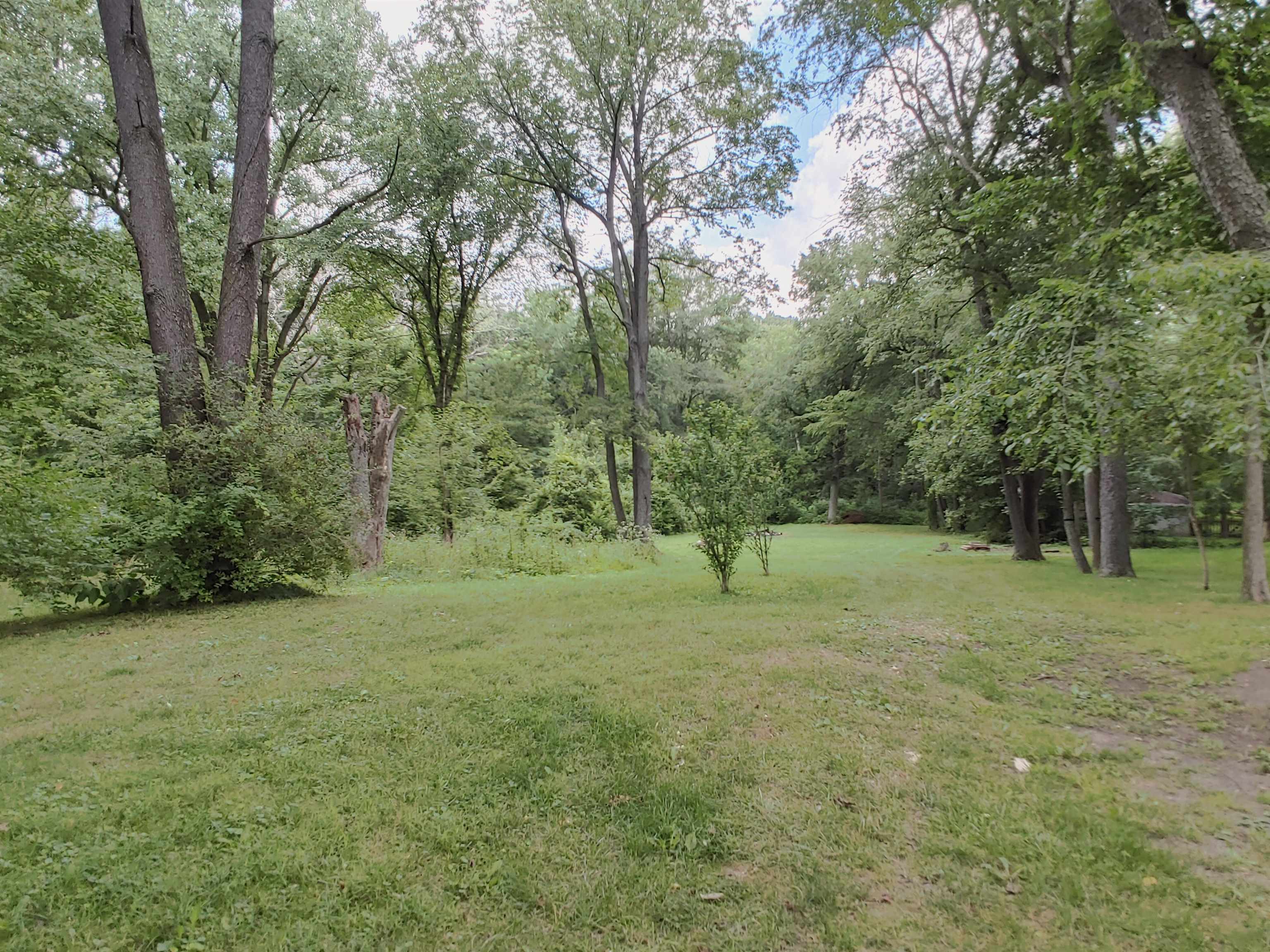 5152 Blackhawk Road Rockford, IL 61109 - Photo 22 of 31 a view of a field with trees in the background