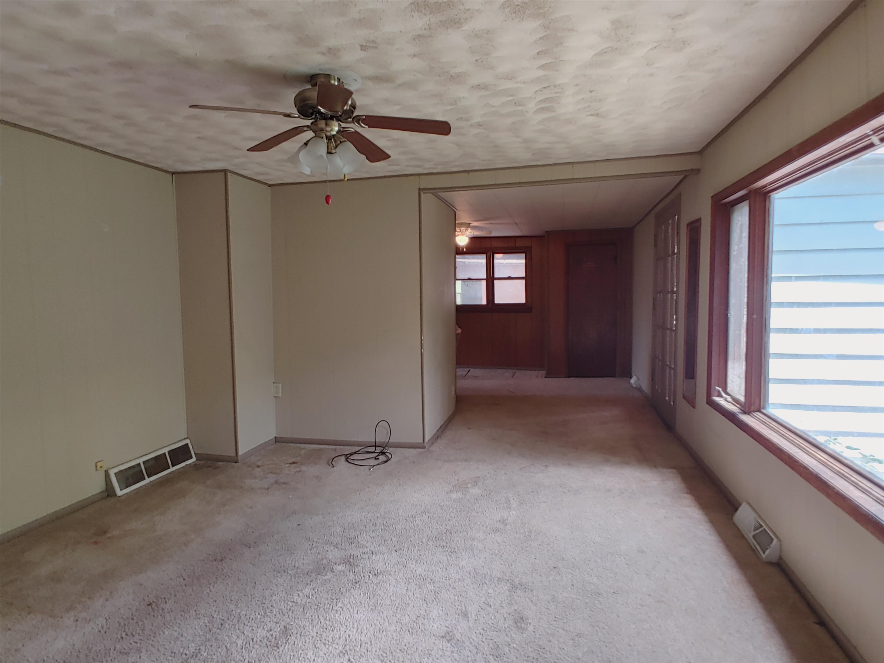 5152 Blackhawk Road Rockford, IL 61109 - Photo 27 of 31 wooden floor in an empty room with a window