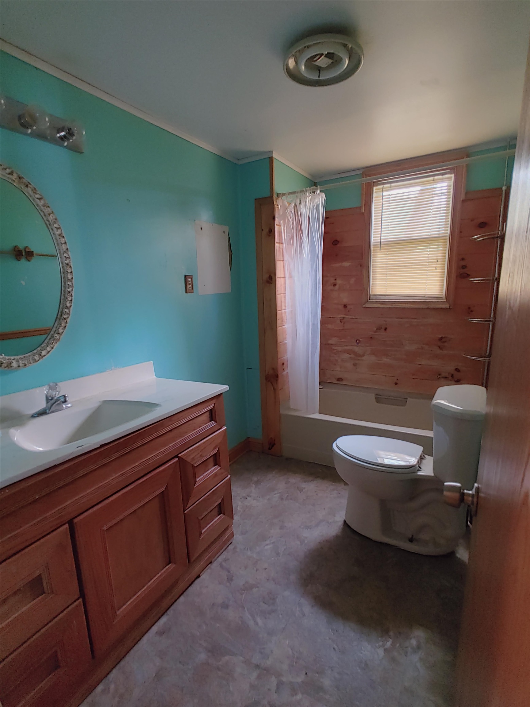 5152 Blackhawk Road Rockford, IL 61109 - Photo 29 of 31 a bathroom with a toilet sink and mirror