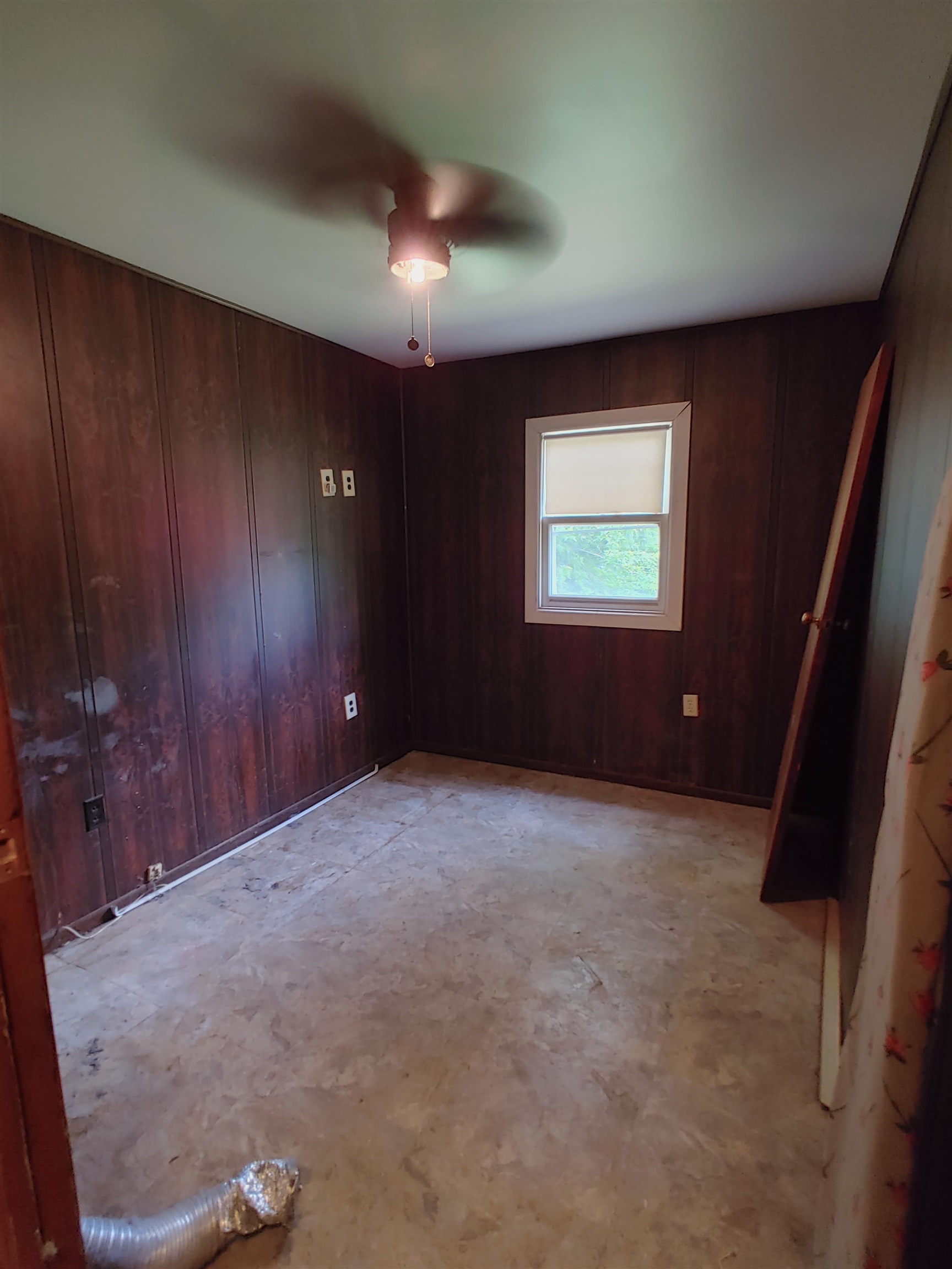 5152 Blackhawk Road Rockford, IL 61109 - Photo 31 of 31 an empty room with windows and closet