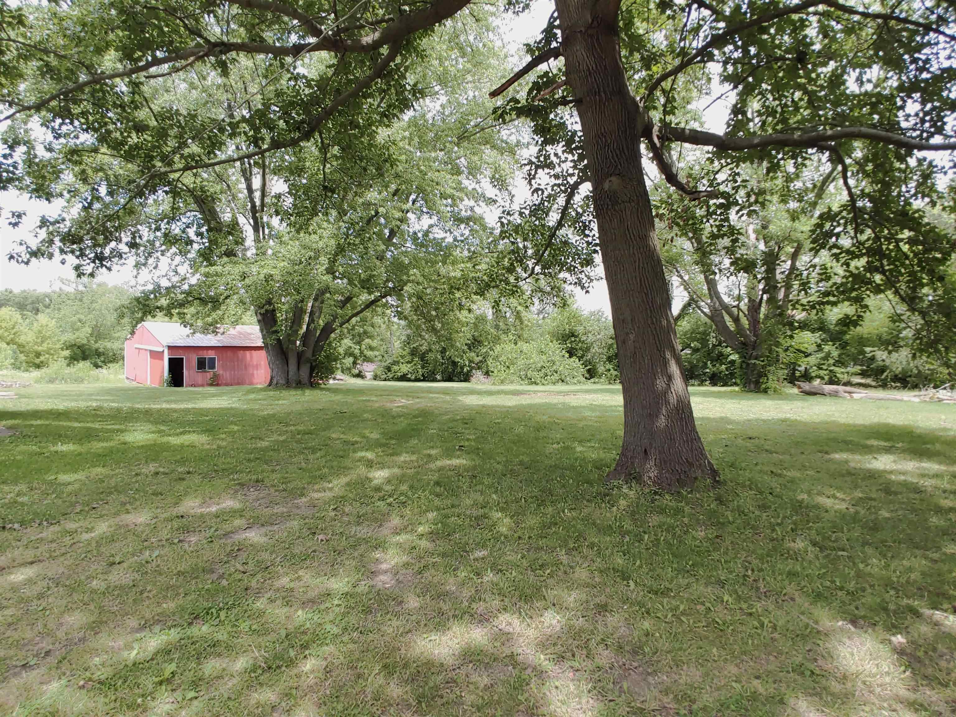 5152 Blackhawk Road Rockford, IL 61109 - Photo 4 of 31 a view of a tree in a yard