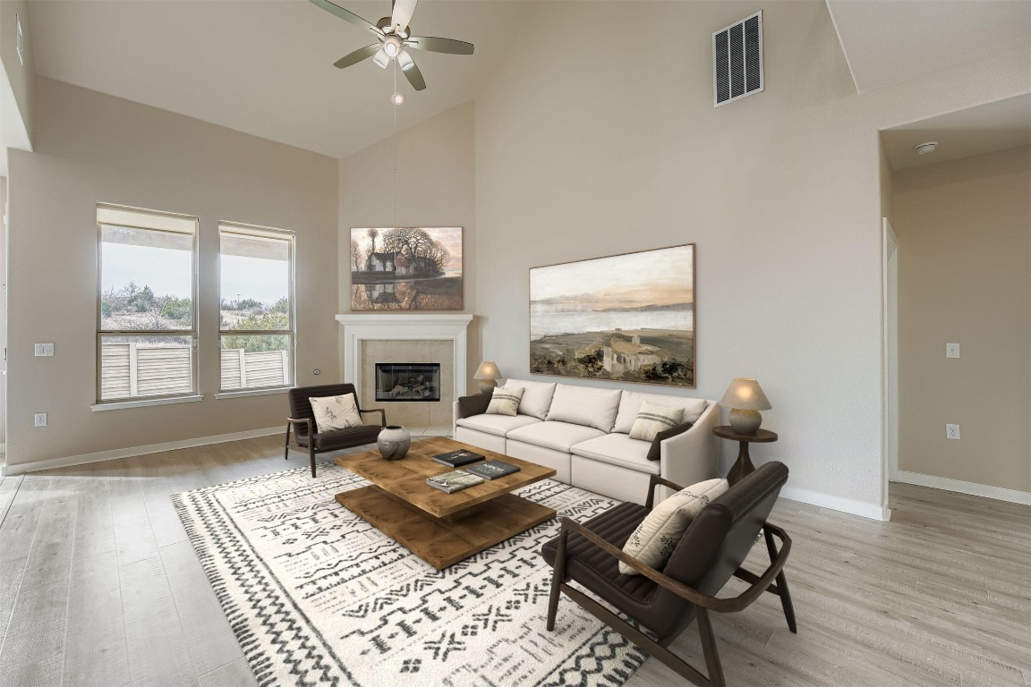 11209 American Mustang Loop Manor, TX 78653 - Photo 5 of 34 a living room with furniture a rug and a fireplace