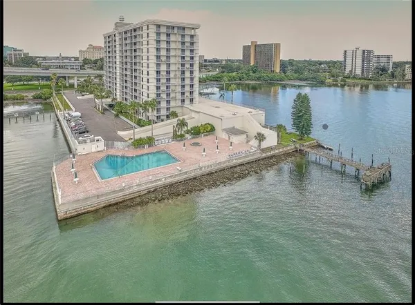 a view of a lake with tall buildings