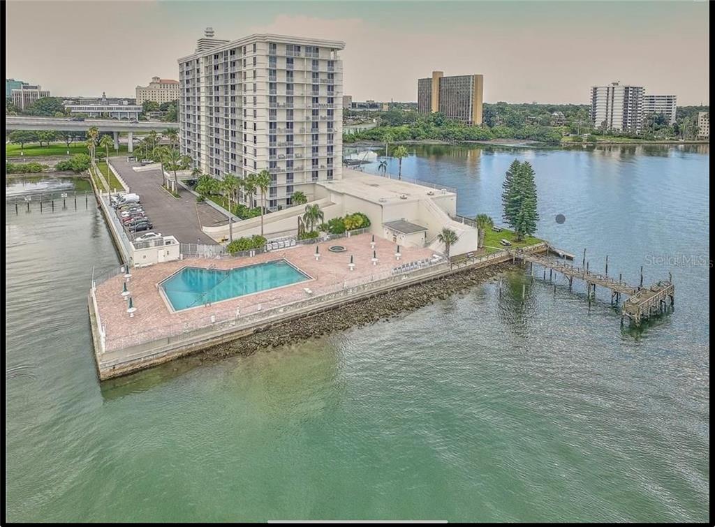 100 Pierce Street, Unit 908 Clearwater, FL 33756 - Photo 1 of 32 a view of a lake with tall buildings