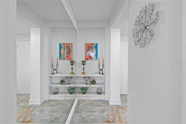 a view of bath room with rug and wall paintings