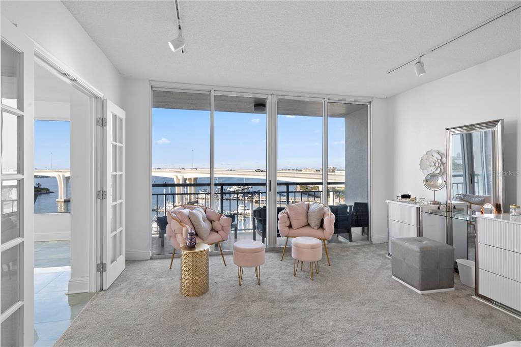 100 Pierce Street, Unit 908 Clearwater, FL 33756 - Photo 14 of 32 a living room with furniture and floor to ceiling windows