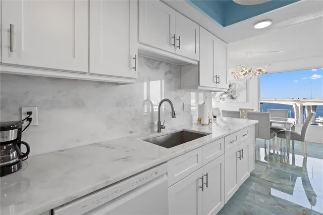 a kitchen with stainless steel appliances granite countertop a sink and cabinets
