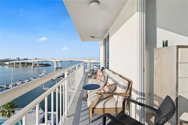 a view of a balcony with furniture