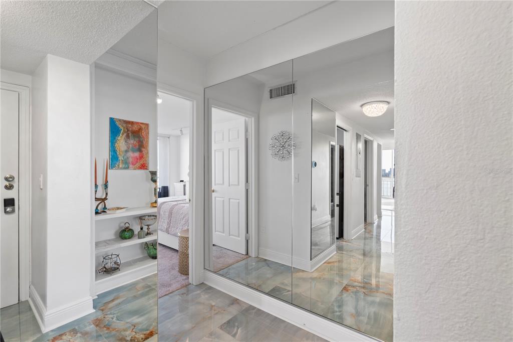 100 Pierce Street, Unit 908 Clearwater, FL 33756 - Photo 19 of 32 a view of a hallway with closet and bathroom