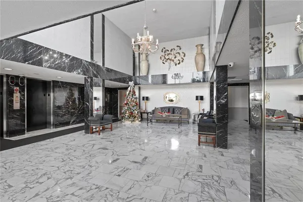 a view of hall way with furniture