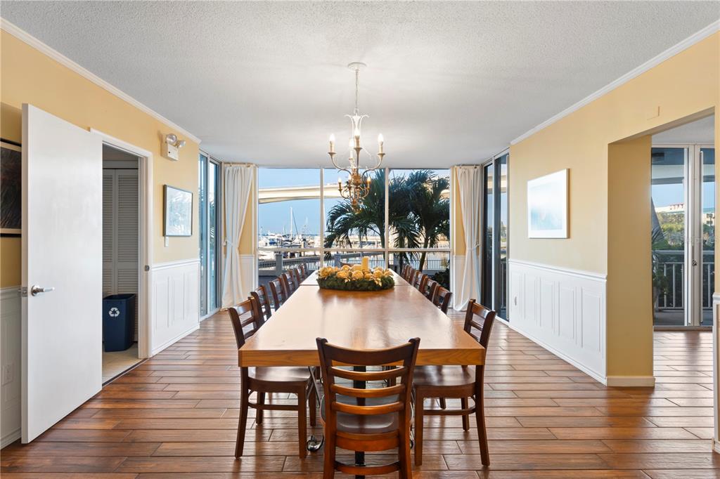 100 Pierce Street, Unit 908 Clearwater, FL 33756 - Photo 30 of 32 a view of a dining room with furniture and wooden floor