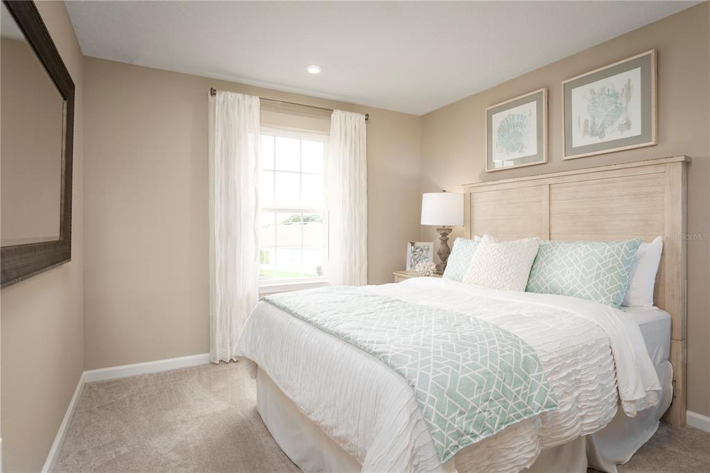 2294 Scenic Pk Loop Wimauma, FL 33598 - Photo 10 of 15 a bedroom with a bed and a window