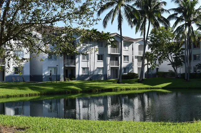 a kitchen with stainless steel appliances a refrigerator a stove and a sink