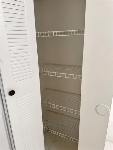 a front view of a house with plants