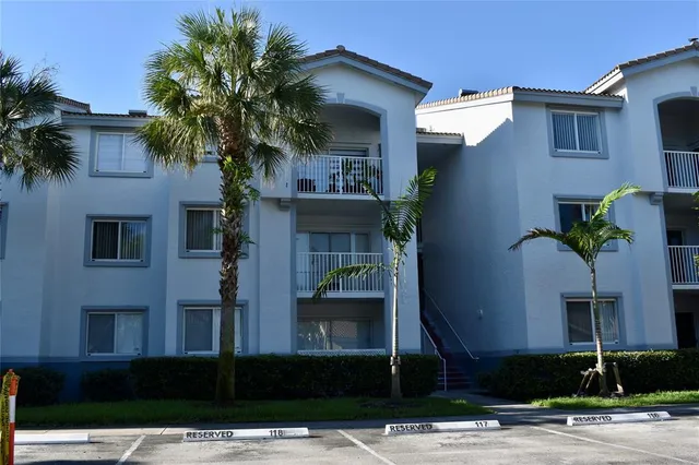 a kitchen with stainless steel appliances a refrigerator and a microwave