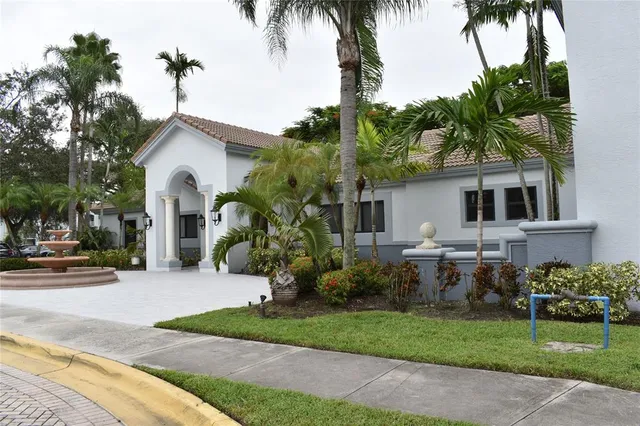 a view of a lake with a yard in front of it