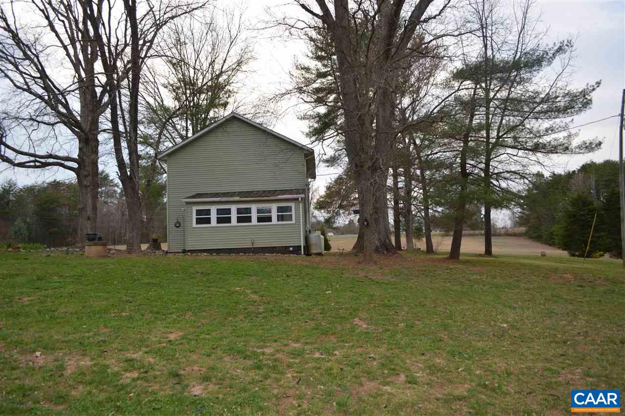2720 Cedar Lane Road Kents Store, VA 23084 - Photo 21 of 27 a view of a house with a yard