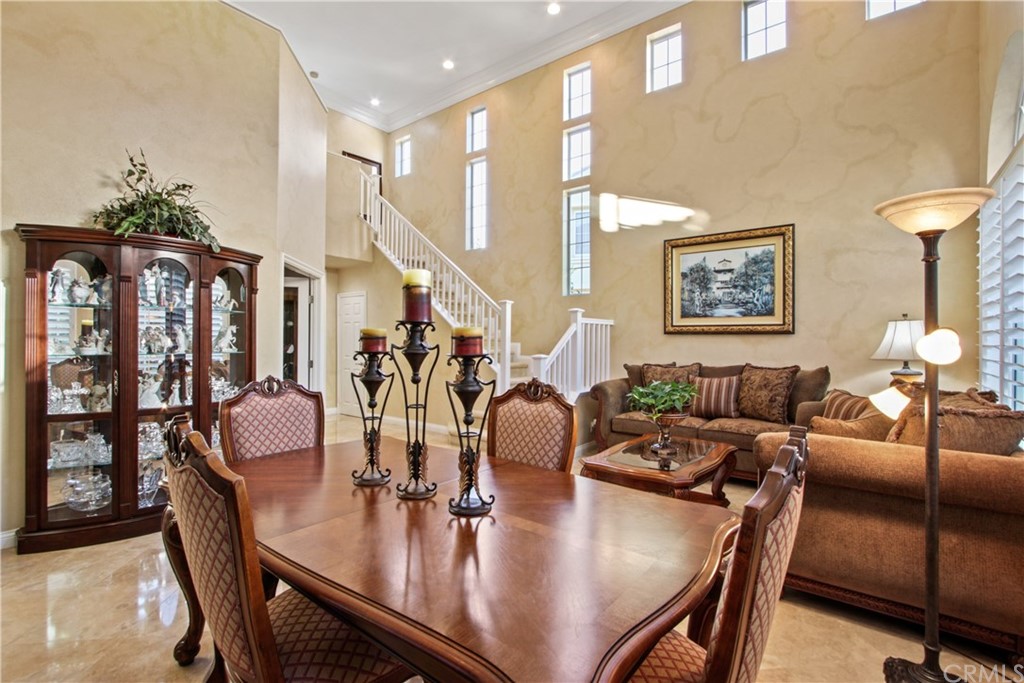 11610 Goetting Avenue Tustin, CA 92782 - Photo 11 of 62 a dining room with furniture and chandelier