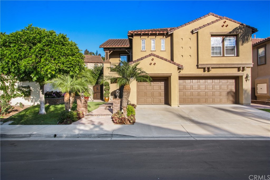 11610 Goetting Avenue Tustin, CA 92782 - Photo 2 of 62 a front view of a house with garden