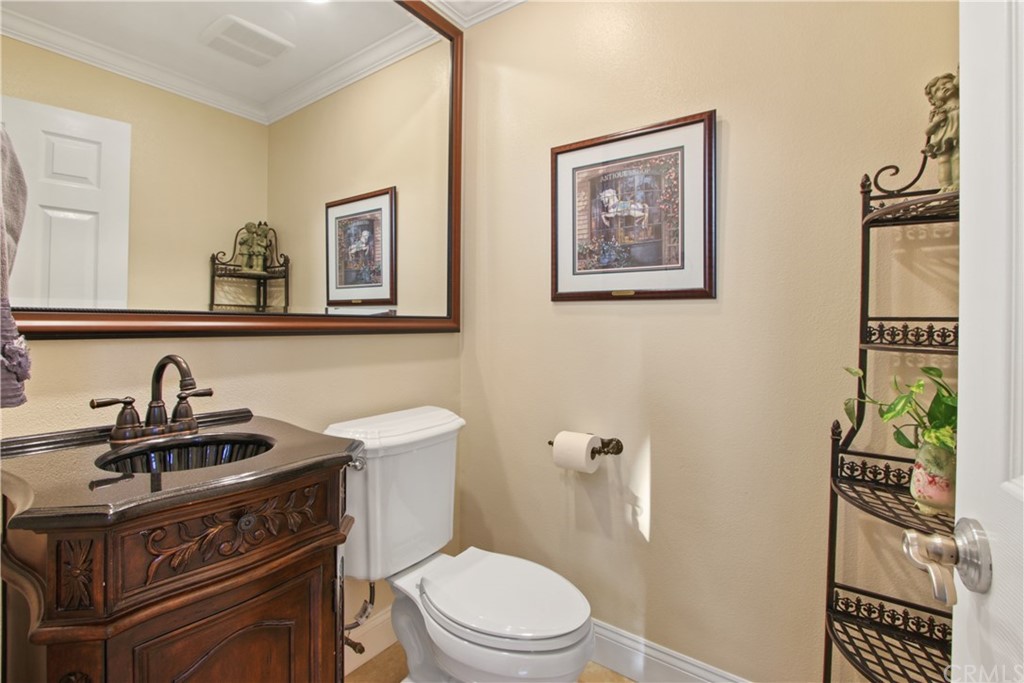 11610 Goetting Avenue Tustin, CA 92782 - Photo 23 of 62 a bathroom with a sink a toilet and a mirror