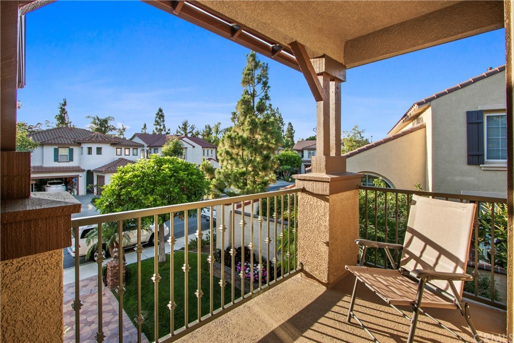 11610 Goetting Avenue Tustin, CA 92782 - Photo 25 of 62 a view of a balcony with wooden floor and iron fence