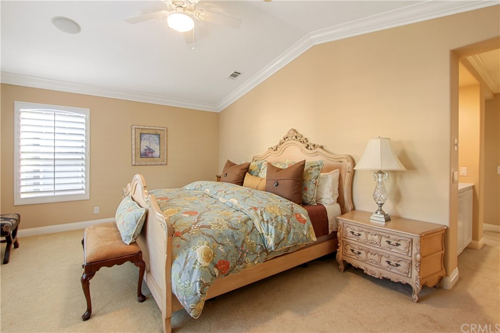 11610 Goetting Avenue Tustin, CA 92782 - Photo 27 of 62 a bedroom with a bed and a chandelier