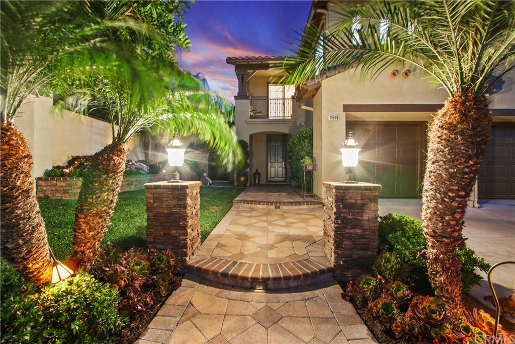 11610 Goetting Avenue Tustin, CA 92782 - Photo 3 of 62 a view of a house with a yard and potted plants