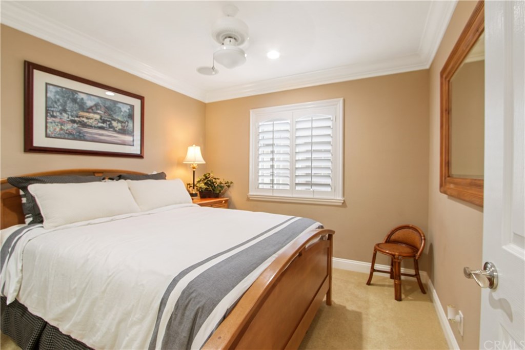 11610 Goetting Avenue Tustin, CA 92782 - Photo 31 of 62 a bedroom with a bed and a table