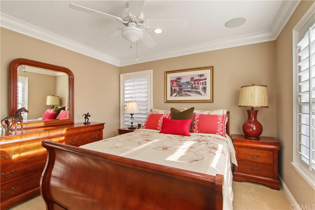 11610 Goetting Avenue Tustin, CA 92782 - Photo 34 of 62 a bed room with a bed and a chandelier