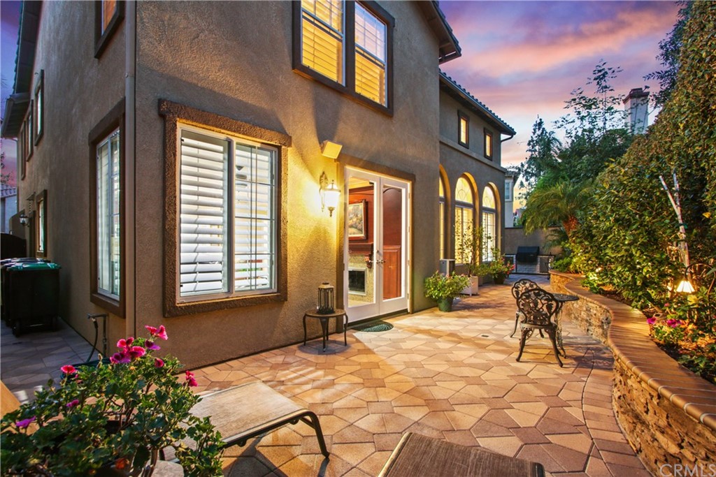 11610 Goetting Avenue Tustin, CA 92782 - Photo 37 of 62 a view of a patio with a table and chairs and potted plants