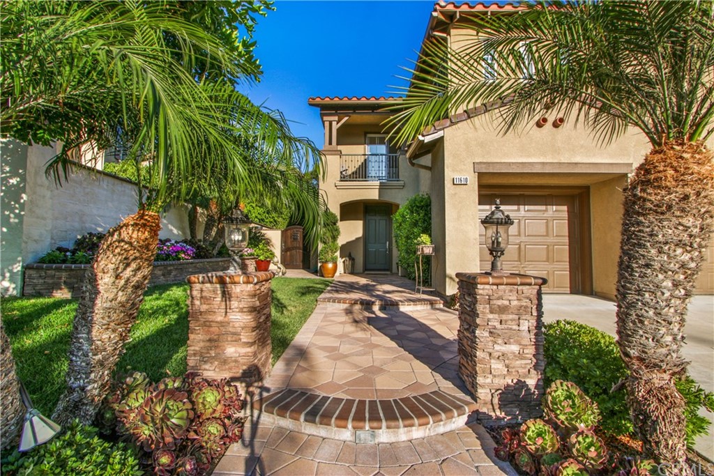 11610 Goetting Avenue Tustin, CA 92782 - Photo 4 of 62 front view of a house with a garden
