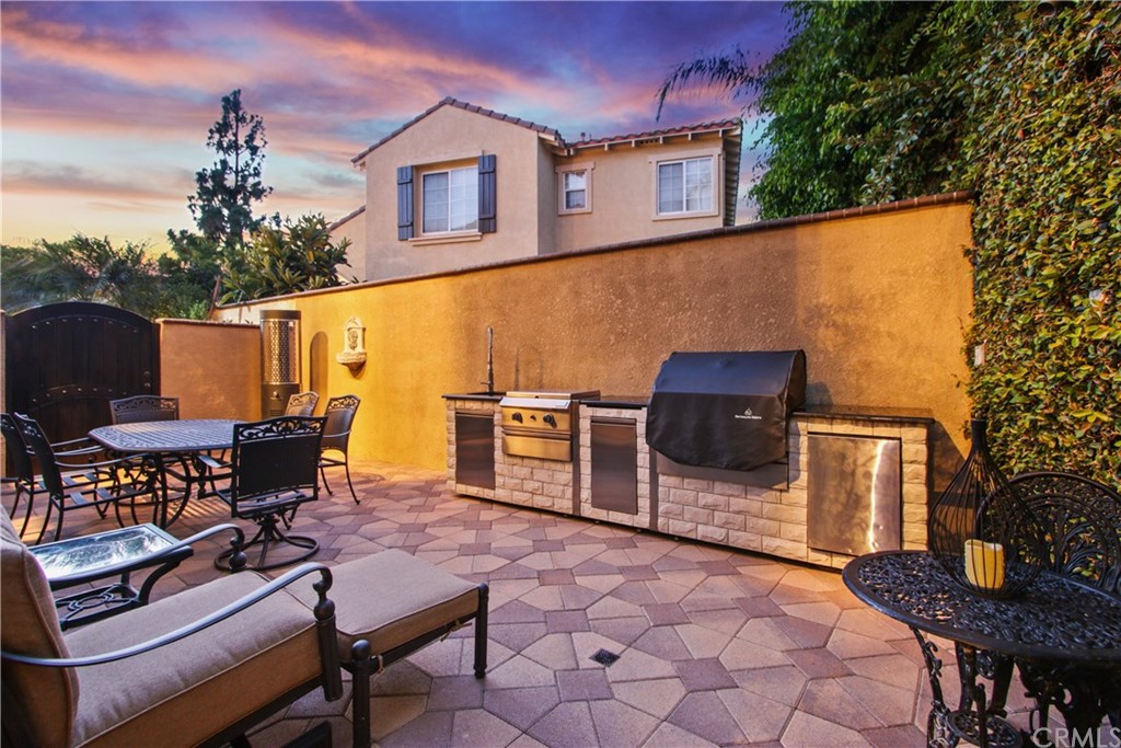 11610 Goetting Avenue Tustin, CA 92782 - Photo 44 of 62 a terrace of a house with outdoor seating
