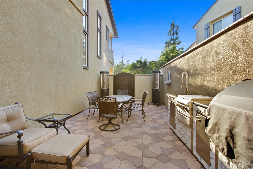 11610 Goetting Avenue Tustin, CA 92782 - Photo 46 of 62 a backyard of a house with table and chairs