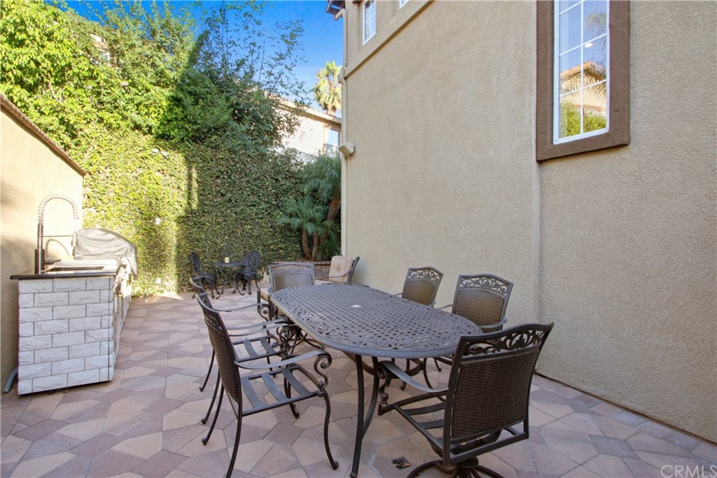 11610 Goetting Avenue Tustin, CA 92782 - Photo 47 of 62 a view of a patio with a table and chairs
