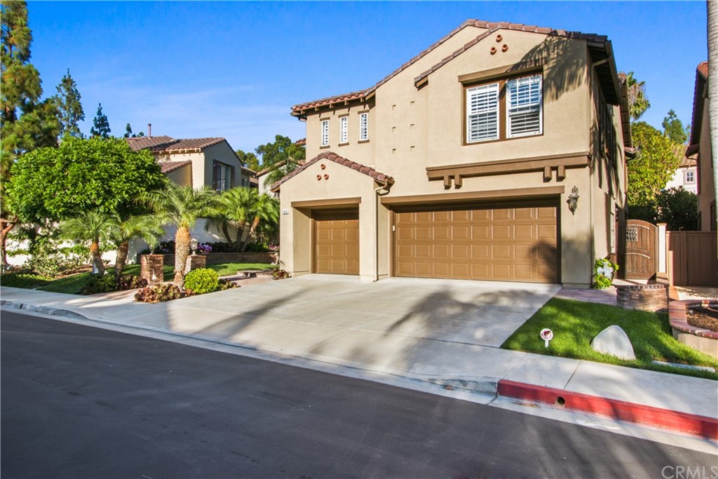 11610 Goetting Avenue Tustin, CA 92782 - Photo 48 of 62 a front view of a house with a yard